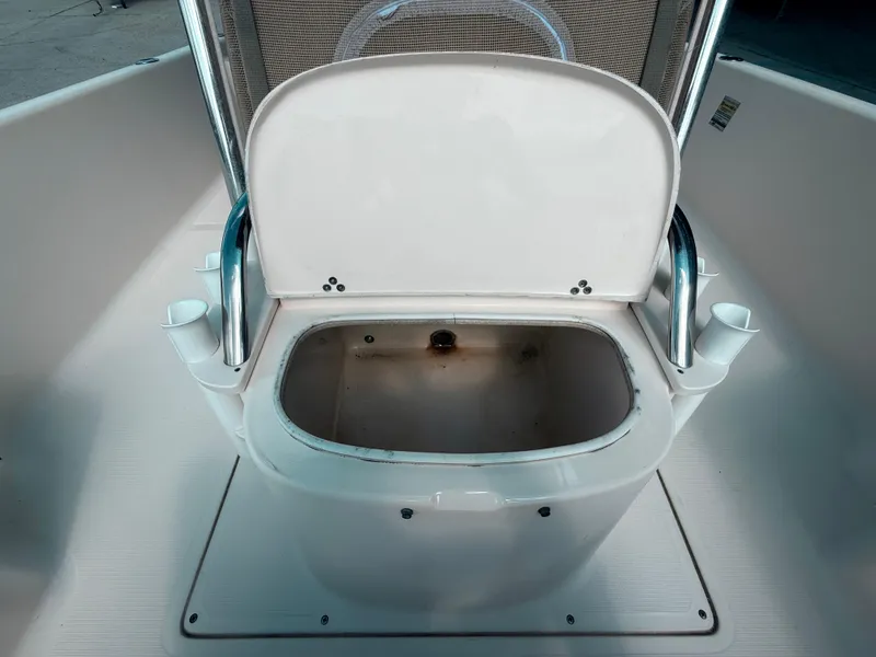 Slide: The Image of 2014 Scout WINYAH BAY 221 boat livewell with open lid and rod holders. - 15