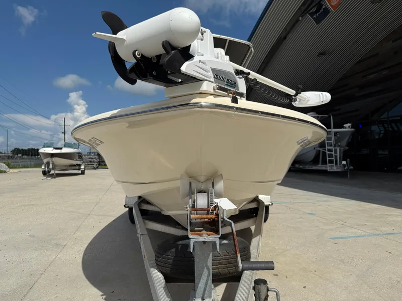 Slide: The Image of 2014 Scout WINYAH BAY 221 boat on trailer, outdoor setting, clear sky. - 3