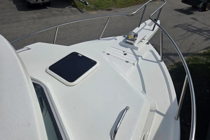 Slide: The Image of 2025 Parker 2820 XLD boat deck with railing and hatch, viewed from above. - 12