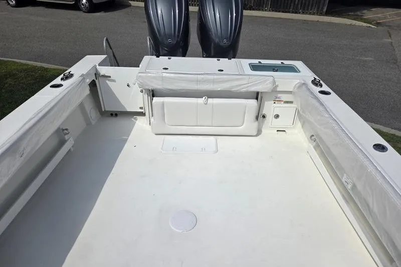 Slide: The Image of 2025 Parker 2820 XLD boat deck with dual engines and seating area. - 9