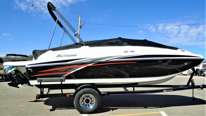 Slide: The Image of 2019 Hurricane SS188 boat on trailer, black and white design, parked outdoors. - 13