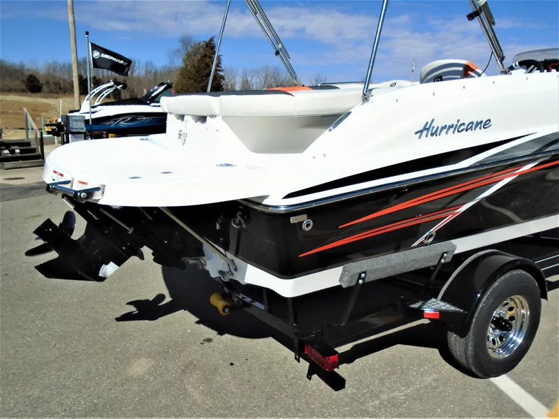Slide: The Image of 2019 Hurricane SS188 boat on trailer, featuring sleek design and dual propellers. - 5