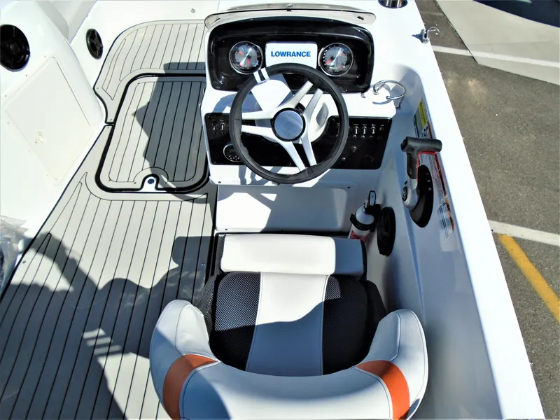 Slide: The Image of 2019 Hurricane SS188 boat cockpit with steering wheel and Lowrance navigation system. - 8