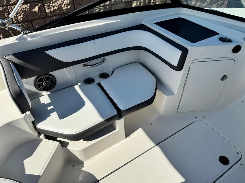 Slide: The Image of Interior of 2015 Sea Ray 19 SPX boat with seating and storage compartments. - 14