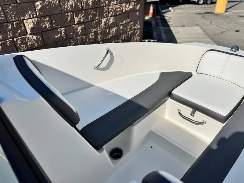 Slide: The Image of Interior of 2015 Sea Ray 19 SPX boat with cushioned seating and sleek design. - 8