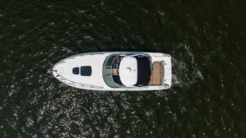 Slide: The Image of Aerial view of 2016 Sea Ray 310 Sundancer yacht cruising on water. - 12