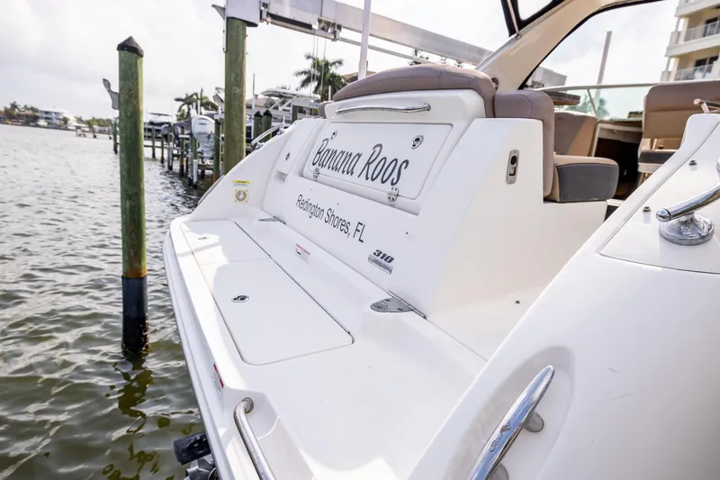 Slide: The Image of 2016 Sea Ray 310 Sundancer docked, featuring "Banana Roos" nameplate, Redington Shores, FL. - 19