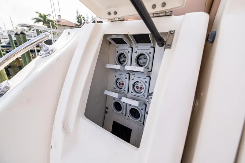 Slide: The Image of Electrical panel on a 2016 Sea Ray 310 Sundancer boat, showcasing gauges and controls. - 23