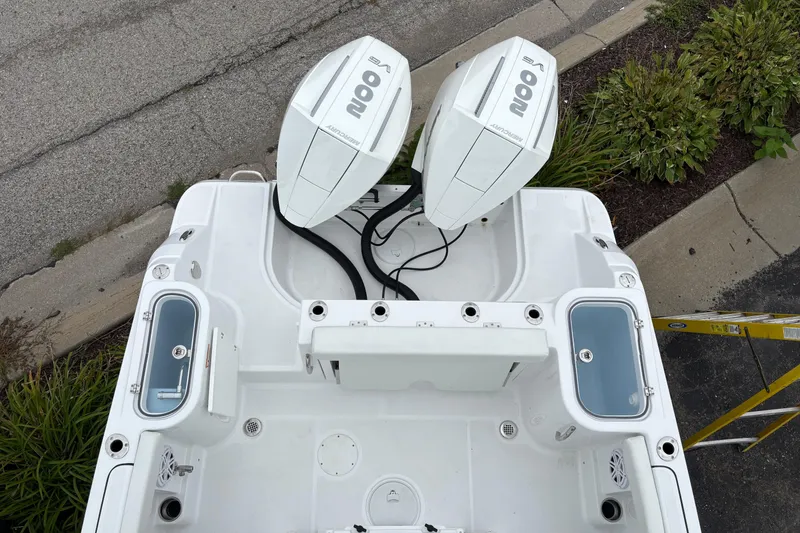 Slide: The Image of Overhead view of 2025 Wellcraft 243 Fisherman boat with dual Mercury outboard engines. - 13