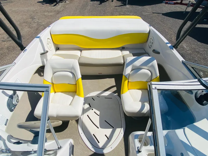 Slide: The Image of 2006 Tahoe Q4 Sport boat interior with yellow and white seating arrangement. - 12