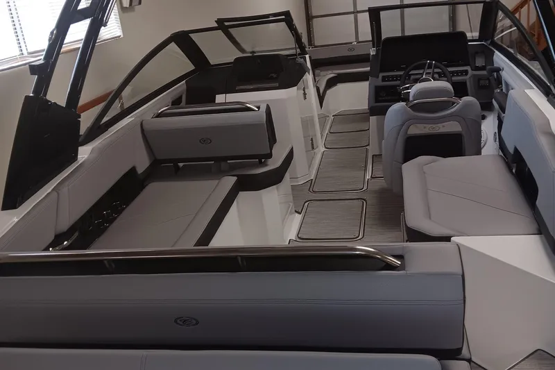 Slide: The Image of 2025 Cobalt R6 boat interior with sleek seating and modern dashboard design. - 14