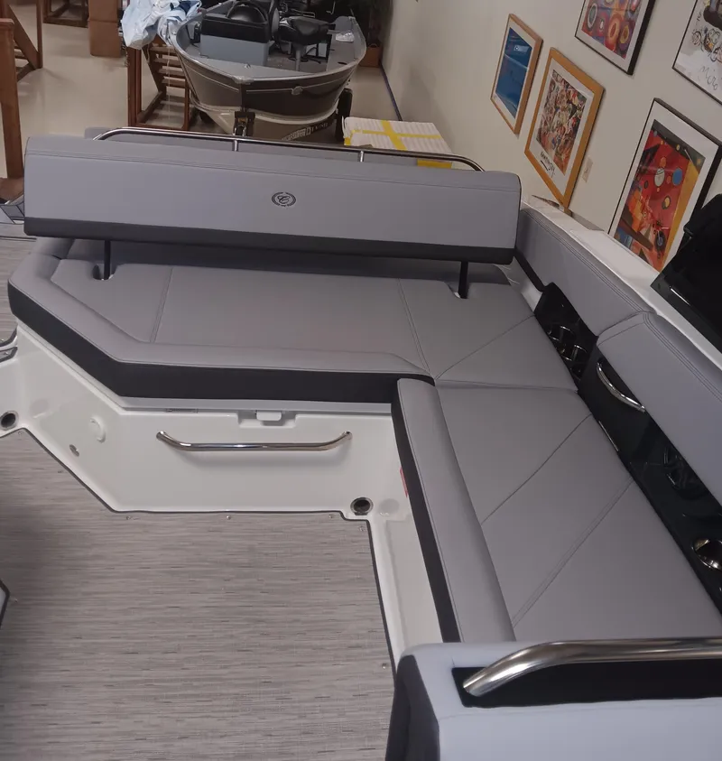 Slide: The Image of 2025 Cobalt R6 boat interior with gray seating and modern design elements. - 19
