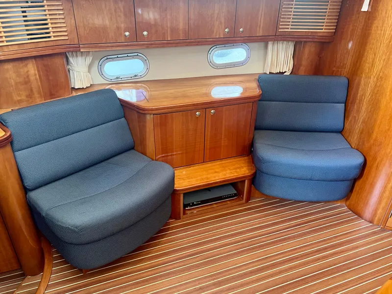 Slide: The Image of Luxurious 2008 Elling E4 yacht interior with wooden cabinetry and plush seating. - 10