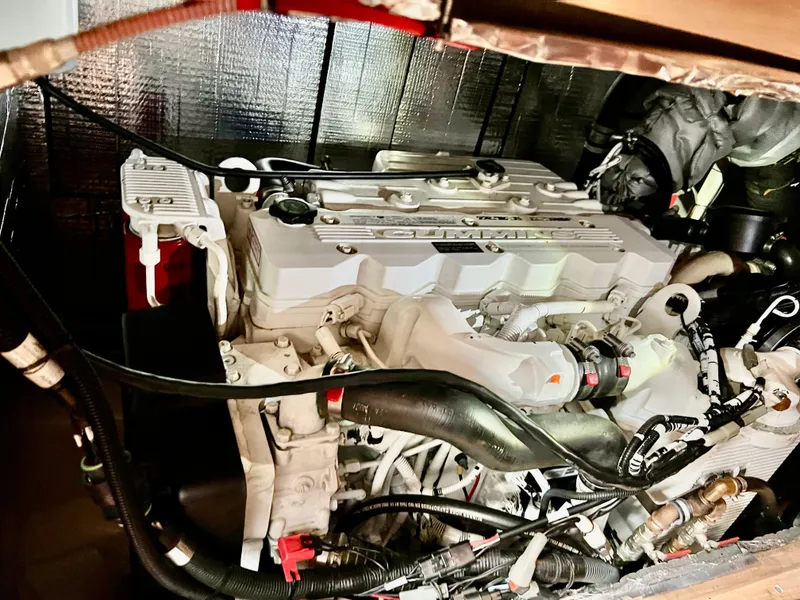 Slide: The Image of Engine compartment of a 2008 Elling E4 yacht, showcasing detailed mechanical components. - 14