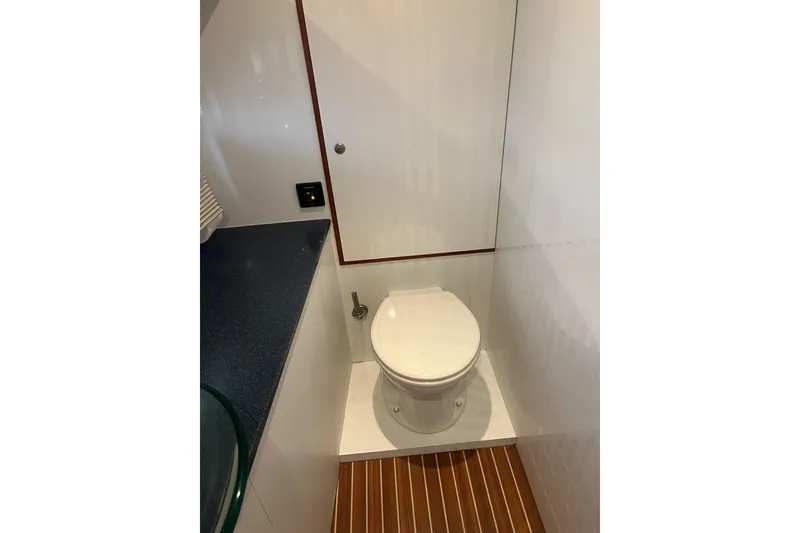 Slide: The Image of Compact bathroom in 2008 Elling E4 yacht with wooden flooring and modern fixtures. - 16