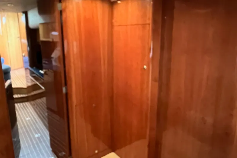 Slide: The Image of Interior of 2008 Elling E4 yacht with polished wooden walls and flooring. - 19