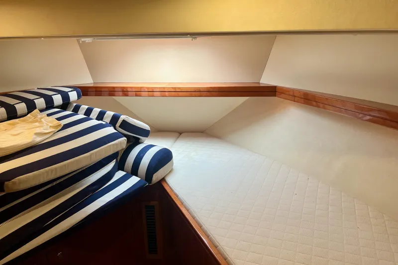 Slide: The Image of Cozy cabin interior of 2008 Elling E4 yacht with striped cushions. - 21