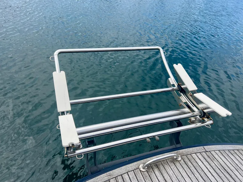 Slide: The Image of Stainless steel boat ladder on Elling E4 yacht, 2008, over calm water. - 25