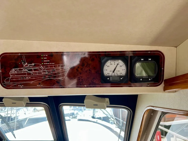 Slide: The Image of Interior of a 2008 Elling E4 yacht showing navigation instruments and control panel. - 4