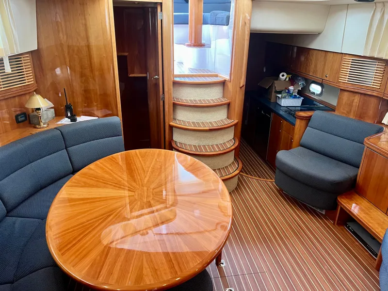 Slide: The Image of Luxurious 2008 Elling E4 yacht interior with wooden finishes and elegant seating area. - 9