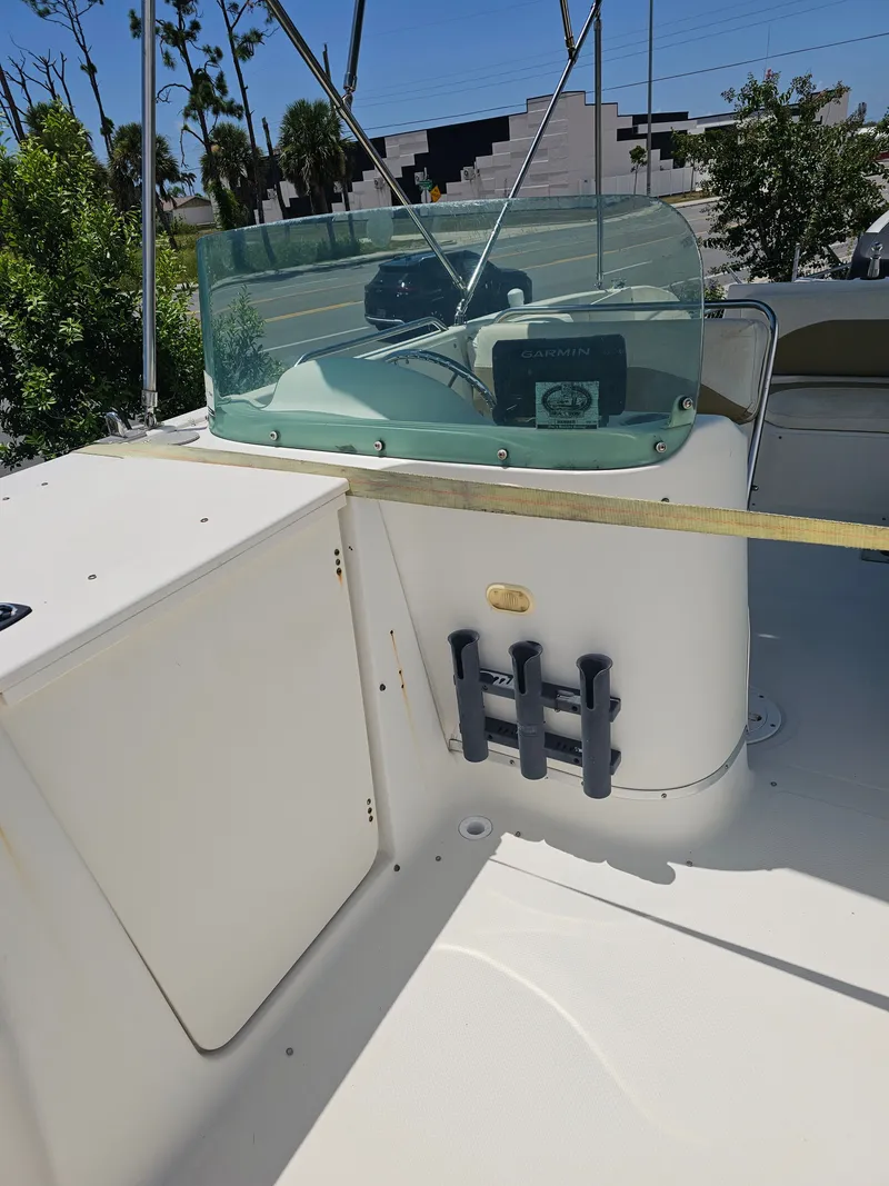 Slide: The Image of 1996 Bayliner 2609 Rendezvous boat interior with windshield and control panel. - 11