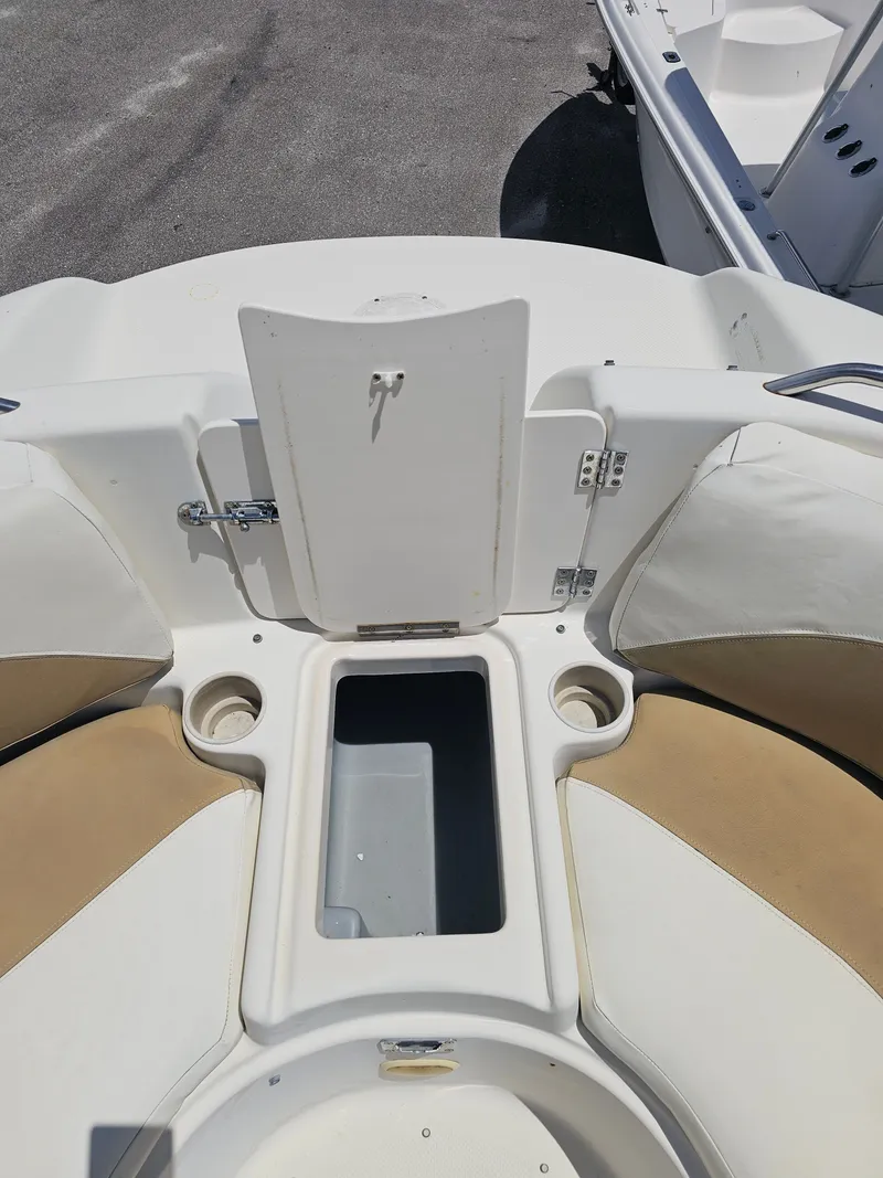 Slide: The Image of 1996 Bayliner 2609 Rendezvous boat interior with storage compartment and cup holders. - 14