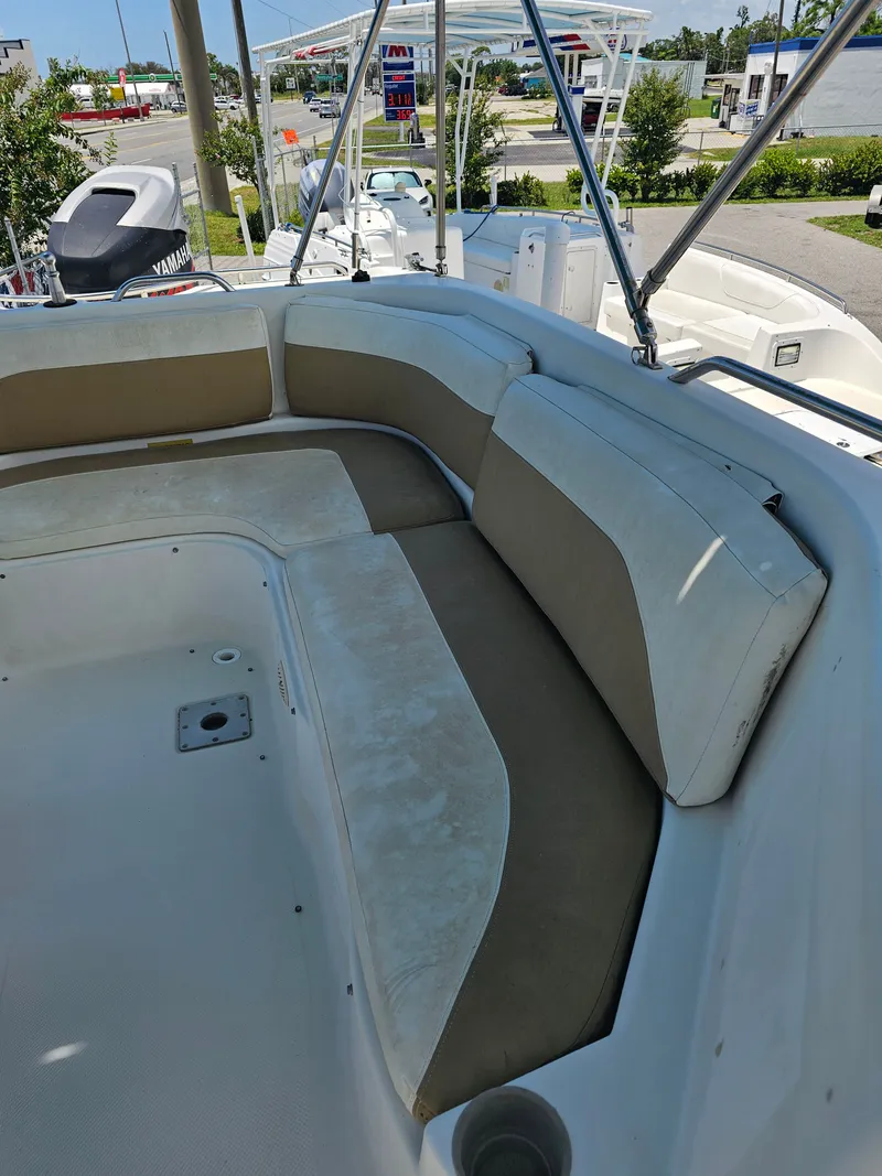 Slide: The Image of 1996 Bayliner 2609 Rendezvous boat with spacious seating area and canopy frame. - 16