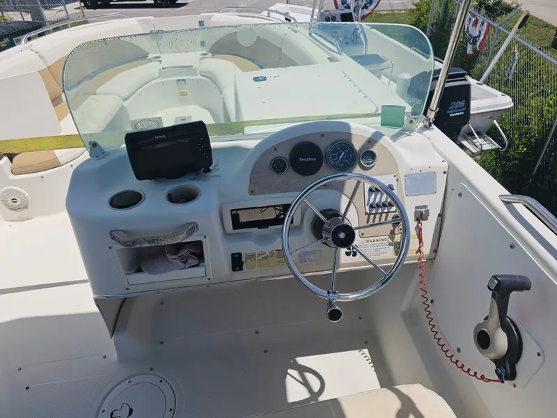 Slide: The Image of 1996 Bayliner 2609 Rendezvous boat dashboard with steering wheel and navigation equipment. - 17