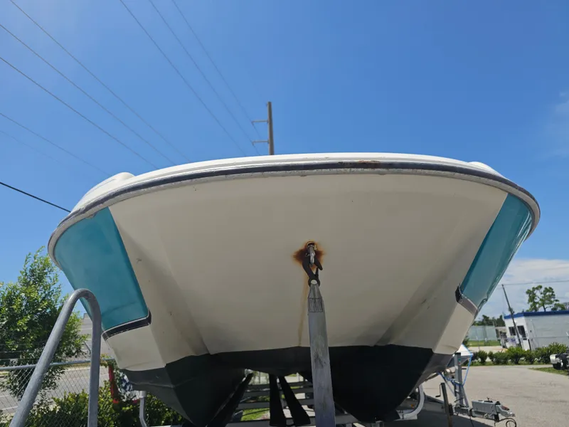 Slide: The Image of 1996 Bayliner 2609 Rendezvous boat on trailer under clear blue sky. - 29