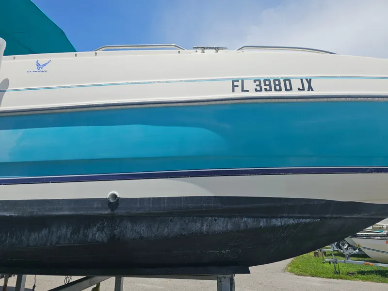 Slide: The Image of 1996 Bayliner 2609 Rendezvous boat with registration FL 3980 JX on trailer. - 30