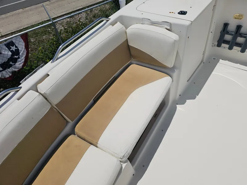 Slide: The Image of 1996 Bayliner 2609 Rendezvous boat interior with beige and white seating. - 9