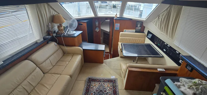Slide: The Image of Interior of 2000 Carver 356 Aft Cabin Motor Yacht with seating and dining area. - 15