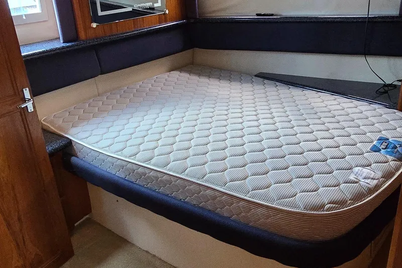 Slide: The Image of Interior of 2000 Carver 356 Aft Cabin Motor Yacht with mattress in cabin. - 26