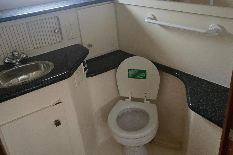 Slide: The Image of Bathroom in 2000 Carver 356 Aft Cabin Motor Yacht with sink and toilet. - 30