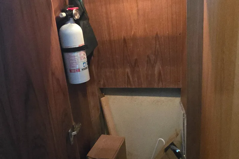 Slide: The Image of Interior of 2000 Carver 356 Aft Cabin Motor Yacht with fire extinguisher. - 35