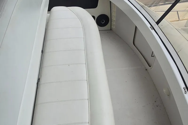 Slide: The Image of 2000 Carver 356 Aft Cabin Motor Yacht interior with white seating and clean design. - 8