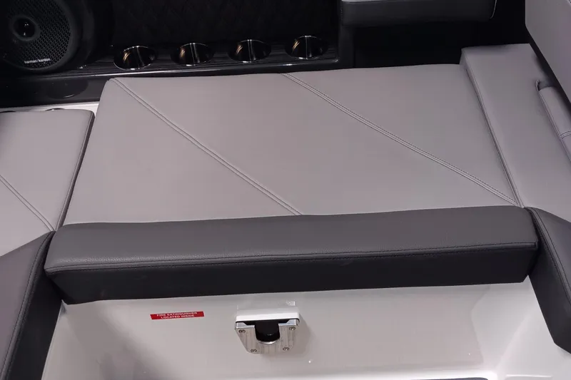 Slide: The Image of 2023 Cobalt R4 boat interior with sleek gray seating and cup holders. - 11