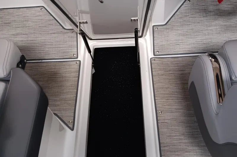 Slide: The Image of 2023 Cobalt R4 boat interior with gray seating and textured flooring. - 15