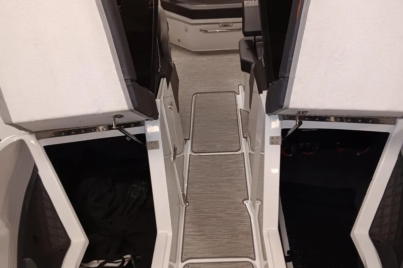 Slide: The Image of Interior view of 2023 Cobalt R4 boat, featuring open storage compartments and sleek flooring. - 16