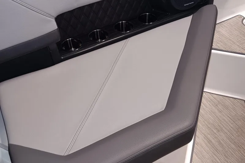Slide: The Image of 2023 Cobalt R4 boat interior with cushioned seating and cup holders. - 9
