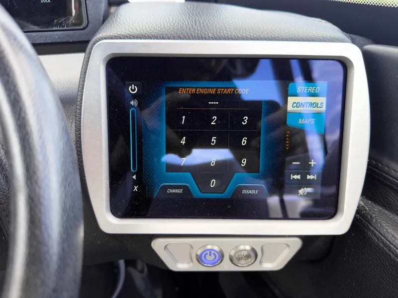 Slide: The Image of Touchscreen control panel in a 2015 Malibu Wakesetter 24 MXZ boat. - 19