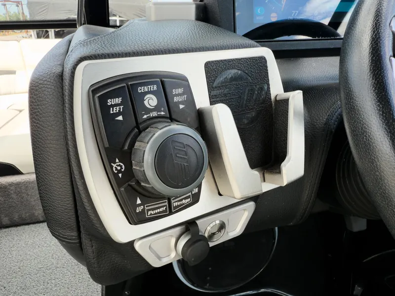 Slide: The Image of Control panel of 2015 Malibu Wakesetter 24 MXZ boat, featuring surf and power settings. - 20