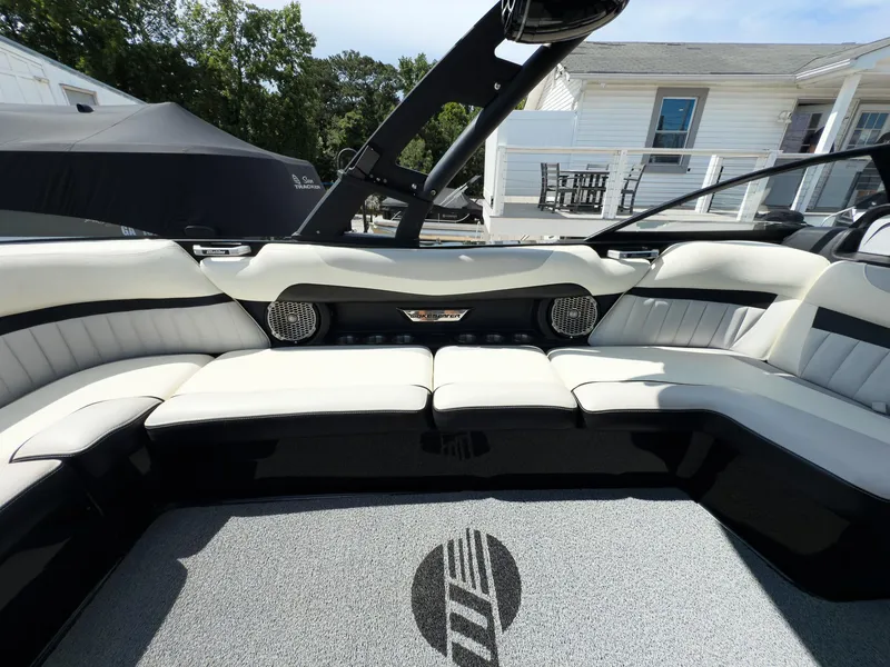 Slide: The Image of 2015 Malibu Wakesetter 24 MXZ interior with white seating and modern design. - 23