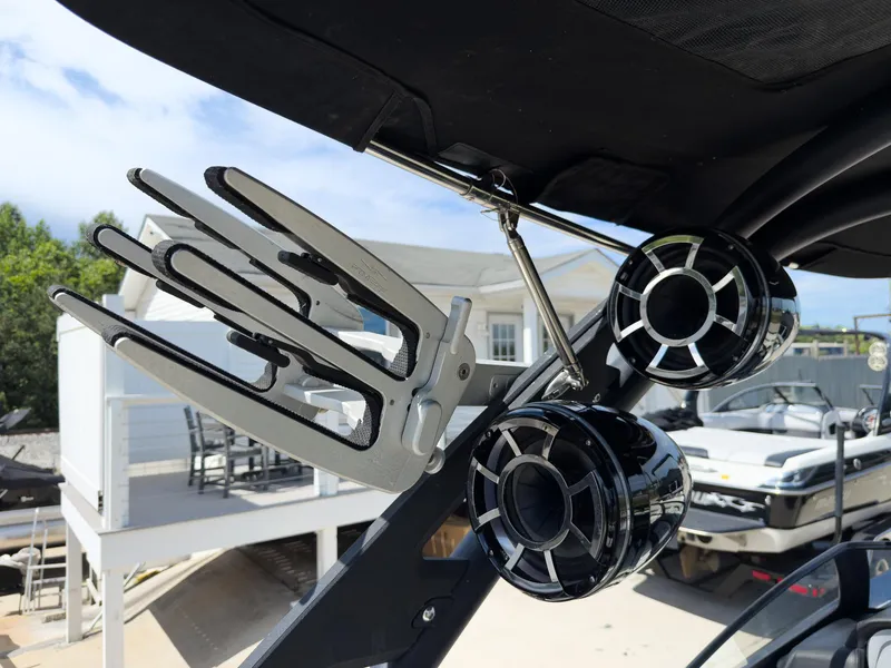 Slide: The Image of 2015 Malibu Wakesetter 24 MXZ boat with wakeboard rack and speakers. - 29