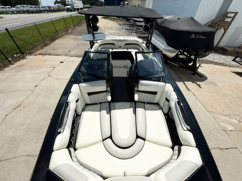 Slide: The Image of 2015 Malibu Wakesetter 24 MXZ boat with spacious seating and sleek design. - 34