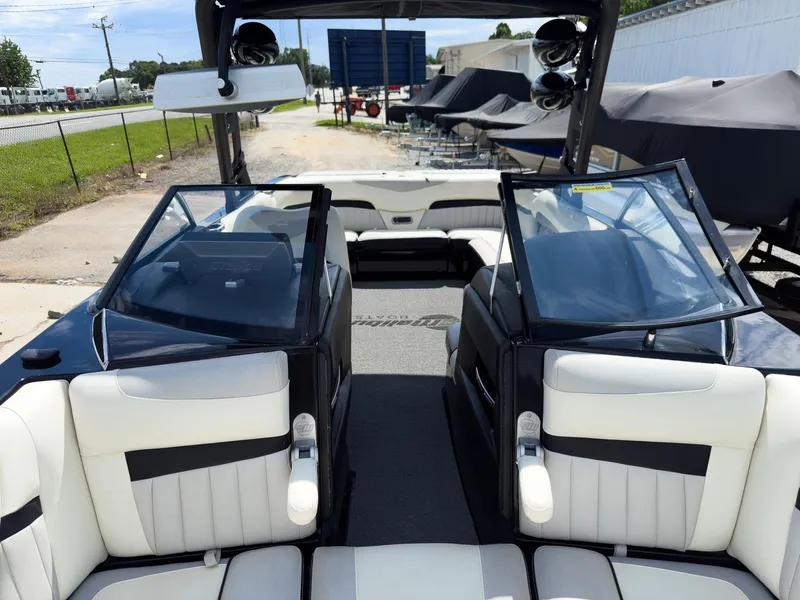 Slide: The Image of 2015 Malibu Wakesetter 24 MXZ interior with white seating and open windshield. - 36