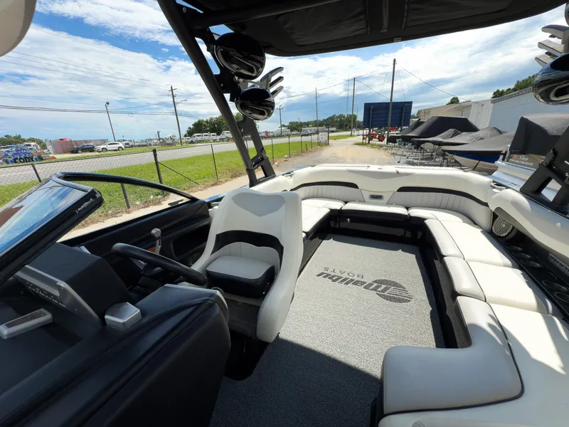 Slide: The Image of Interior of 2015 Malibu Wakesetter 24 MXZ boat with seating and steering wheel. - 39