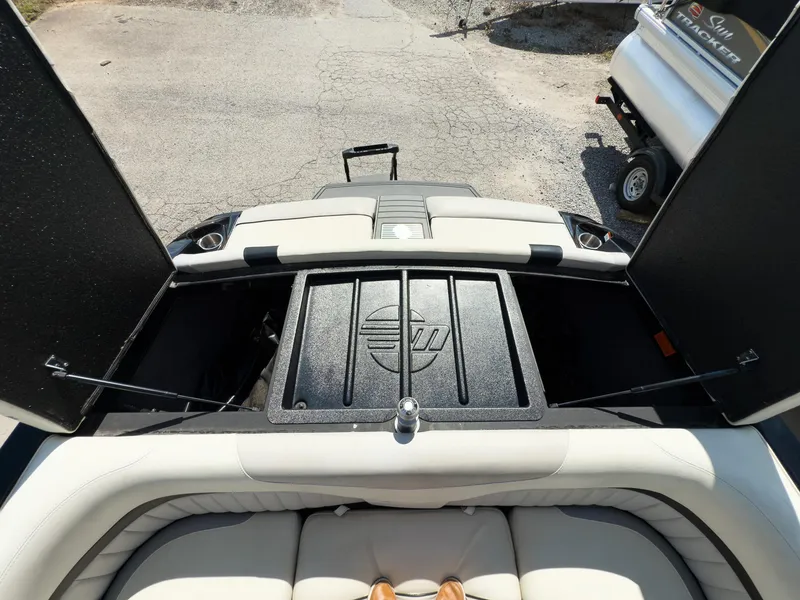 Slide: The Image of 2015 Malibu Wakesetter 24 MXZ boat interior with open storage compartments. - 41