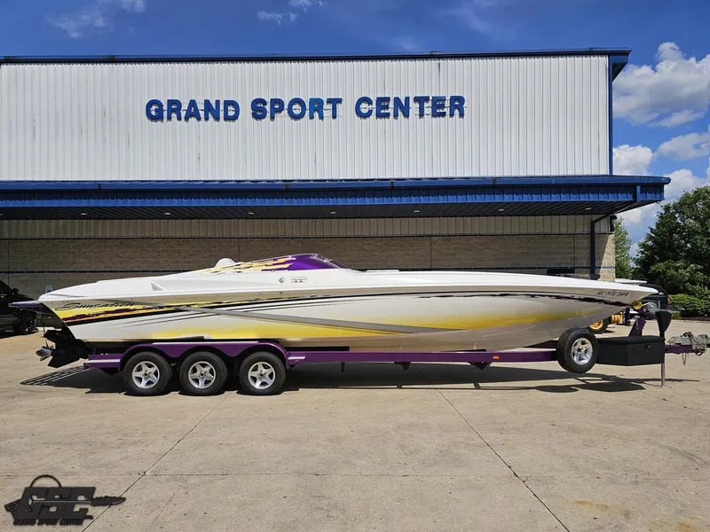 Slide: The Image of 2003 Sunsation 32 Dominator boat on trailer at Grand Sport Center. - 1