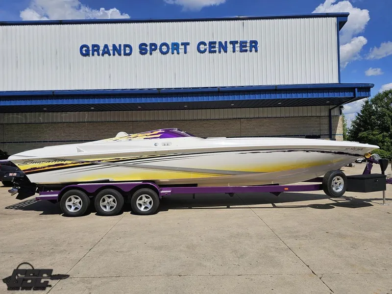 Slide: The Image of 2003 Sunsation 32 Dominator boat on trailer at Grand Sport Center. - 3